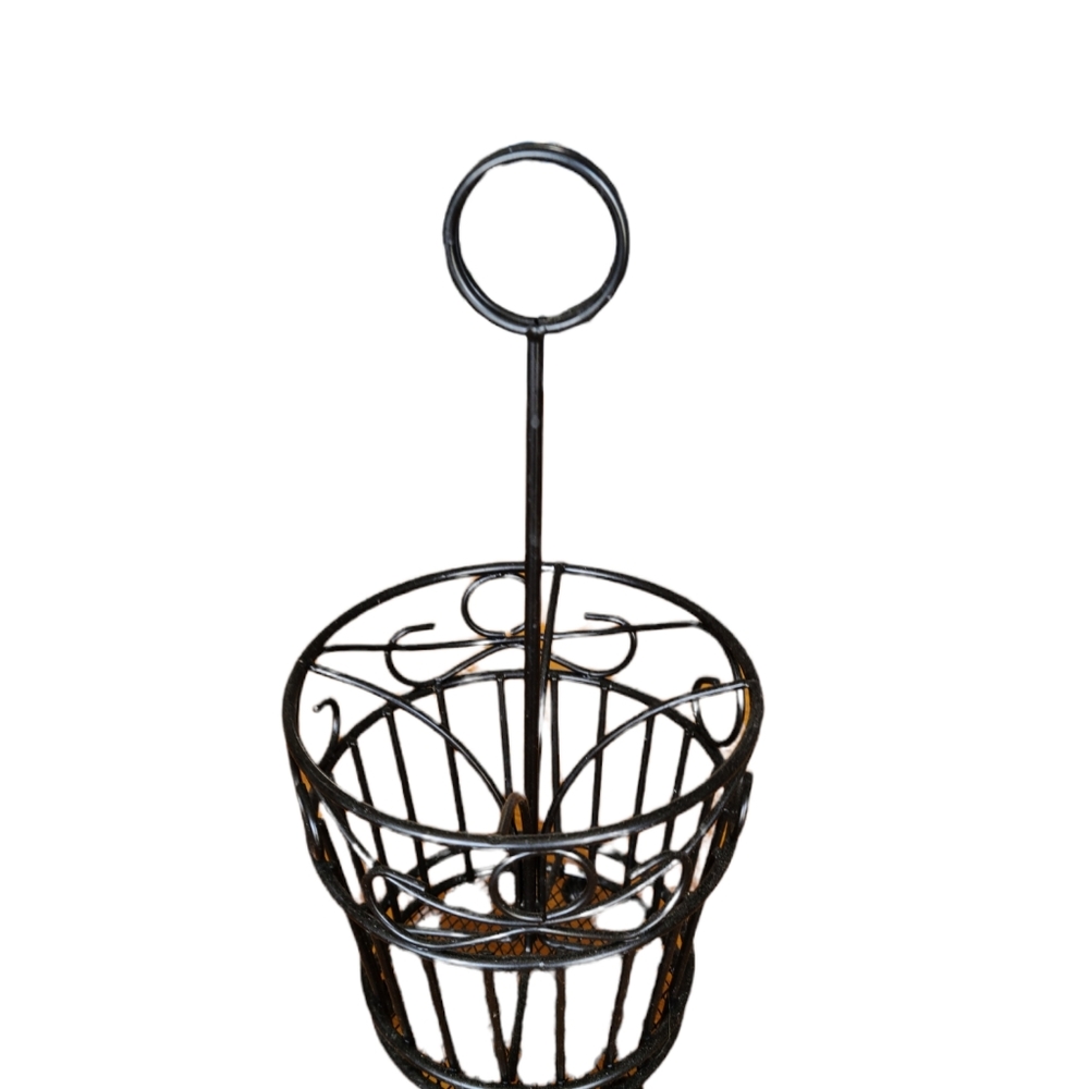 Black metal utensil holder.